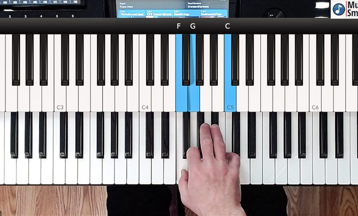 Hands on keyboard during online piano lesson