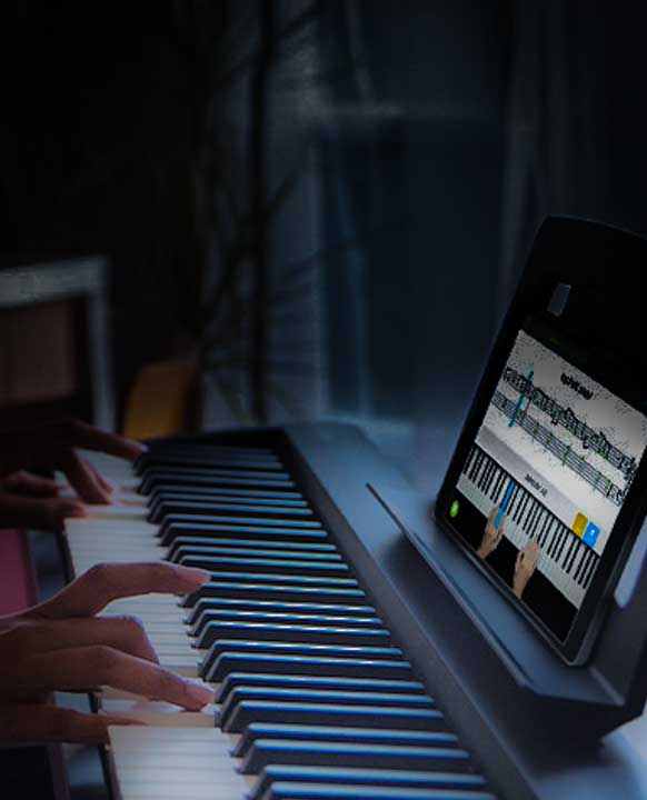 Hands on piano keys in online lesson